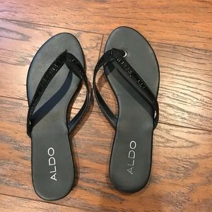 Black Aldo flip flops